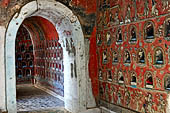 Myanmar, Burma, Nyaungshwe. Small Buddhas set into the temple wall, Shwe Yaunghwe Kyaung monastery, near Inle Lake. 